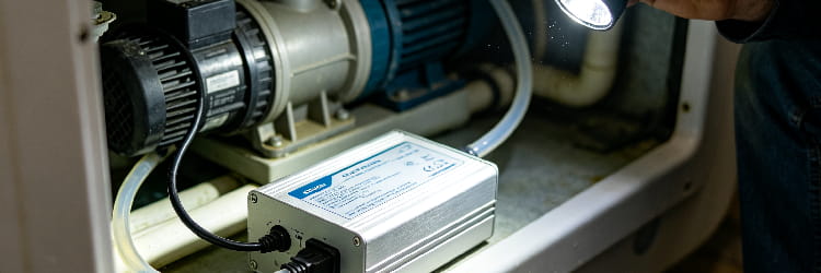 1783653195201519.png Inspection of hot tub internal components including pump and control box with flashligh.png